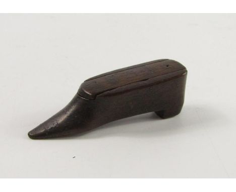An early 19thC wooden shoe snuff box, with stud work decoration, lid bearing date 1834, 8.5cm long.