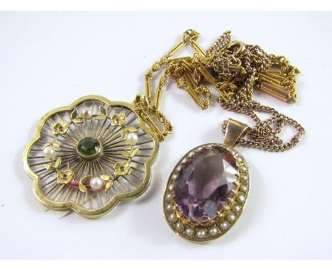 A yellow metal seed pearl and demantoid garnet pendant, of floral form, on a cable link chain, and an oval amethyst pendant i
