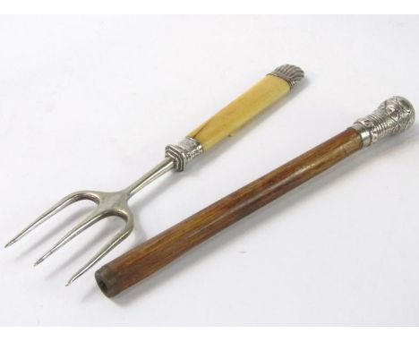A Victorian bamboo and silver parasol handle, Birmingham, 1900, and a toasting fork with silver mounts. (2)