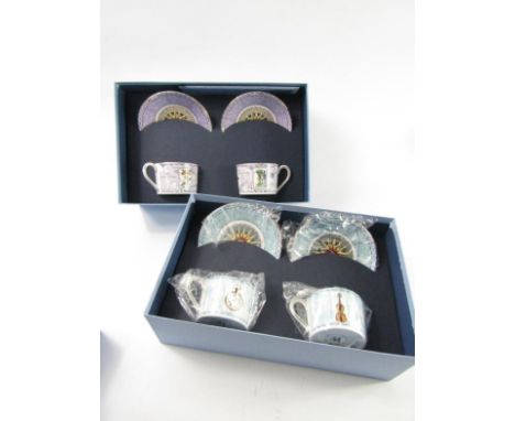 Two Wedgwood 'A Celebration of the Millennium' boxed pairs of coffee cups and saucers.