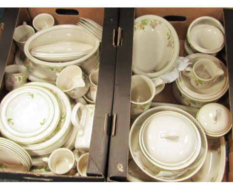 A Wedgwood pottery part dinner and tea service decorated in the Wild Apple pattern, comprising; one circular and one oval pla
