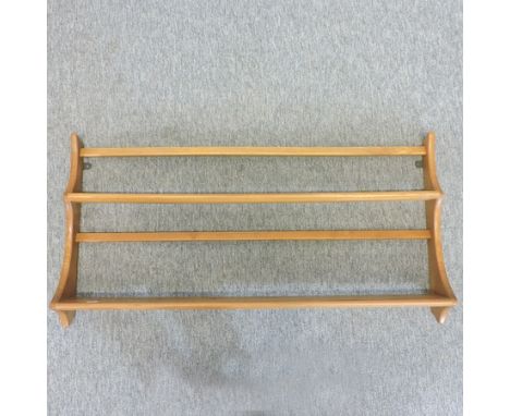 A light elm Ercol plate rack, 97cm