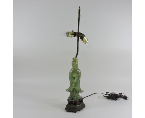 A table lamp, in the form of a quartz figure of guan yin, 67cm high overall