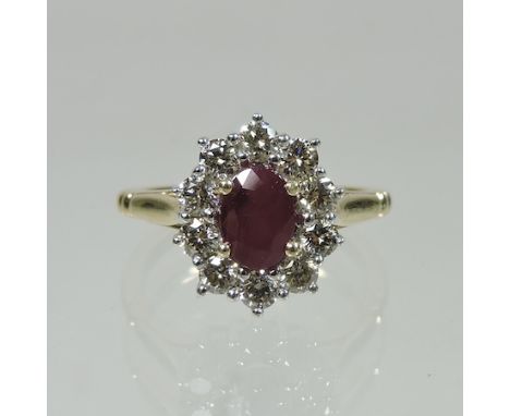 A 9 carat gold ruby and diamond cluster, the diamonds approximately 0.8 carat, the ruby approximately 0.7 carat
