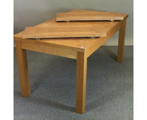 A light oak dining table, on square legs, 160 x 90cm