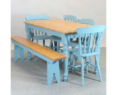 A pine kitchen table with painted legs, 148 x 75cm, together with a set of four painted chairs and a bench