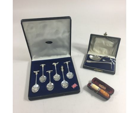 A cased set of Falklands commemorative silver plated teaspoons, together with a children's spoon and pusher set, cased and an