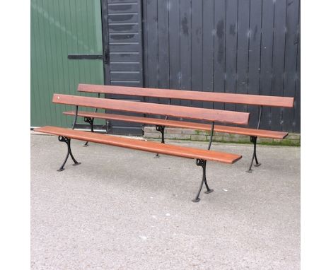 A pine and iron bench, 310cm, together with another, 245cm
