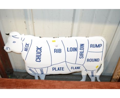 An enamel cow sign
