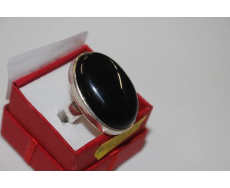 A very large sterling silver and black onyx ring, size R, 13.9g