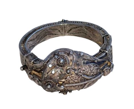 Tibetan 19th Century silver filigree bangle with opening clasp.