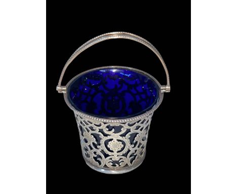 Edwardian silver pierced and engraved basket with blue glass liner, Birmingham 1907, 11cm to top of handle.