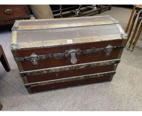 Vintage canvas bound dome topped trunk and collection of teddies and dolls.