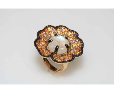 Silver gilt moonstone and multi coloured sapphire ring, size P.