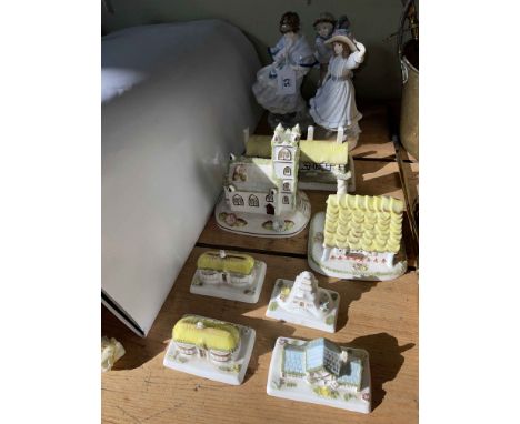 Three Royal Worcester figures and seven Coalport cottages.