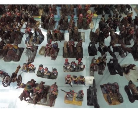 A quantity of hand painted vintage military models predominantly made of metal