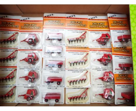 ERTL - 24 metal replica diecast Implements, 1:64 scale, mint in blister packs, stock no 1589 - Est £40 - £60