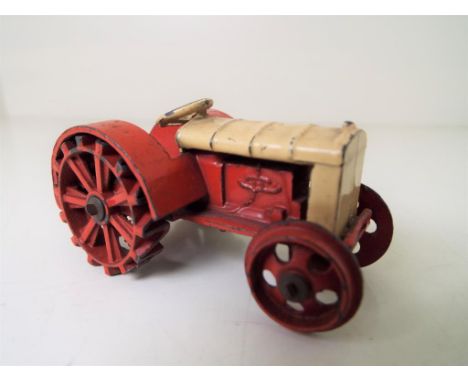 Dinky - a pre-war Farm Tractor, yellow and red body, red wheels lacking tow hook # 22E, good - Est £50 - £80