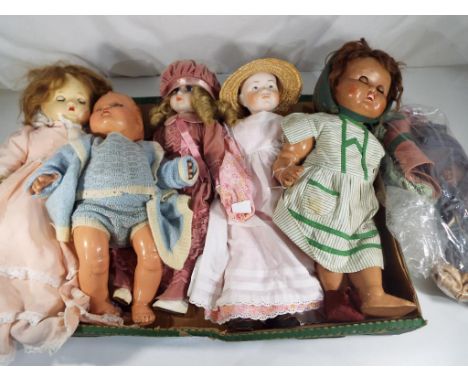 Dolls - a quantity of five vintage and antique dressed dolls to include a Peliable doll with sleeping eyes, a BNB of London d