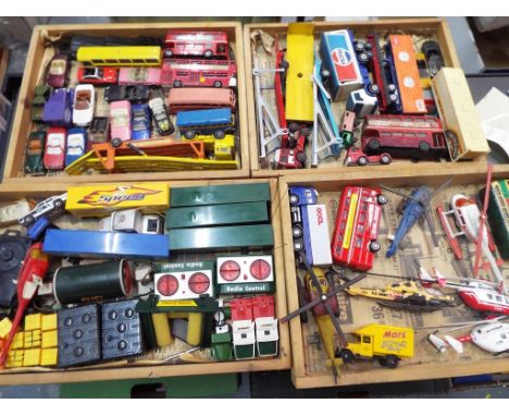 Diecast - four trays of diecast model motor vehicles to include helicopters, HGV's, cars and similar including a small quanti