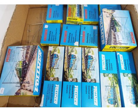 Vollmer - fourteen boxes of HO scale scenics by Vollmer to include overhead line, mast with base, tower mast with side arm an
