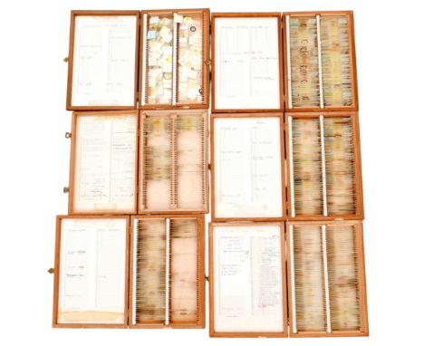 A collection of microscope slides, in six fitted wooden cases, including mostly plant specimens, bryophyta, flowers, but also