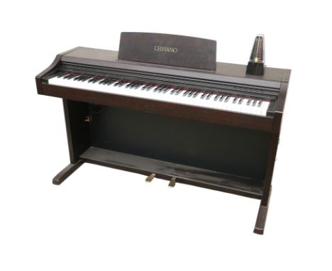 A Casio Celviano AP-21V digital piano, serial R006268M, 136cm wide, together with a modern black plastic metronome. (2)