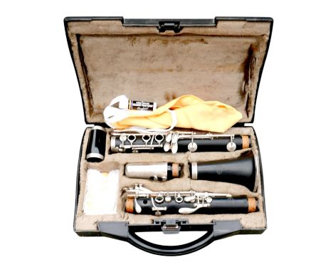 A Buffet Crampon &amp; Co B12 clarinet, with several reeds, cleaning cloth, and stick of cork grease, in fitted carry case.