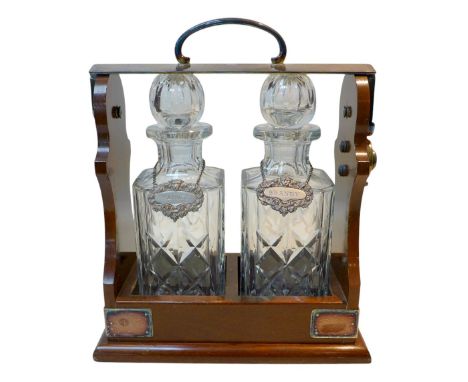 A 20th century two decanter tantalus, 28 by 15 by 34cm high.
