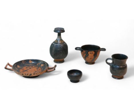 Five pieces of Attic style terracotta pottery, including a kylix, 22 by 15.7 by 4.5cm high overall, a skyphos decorated with 