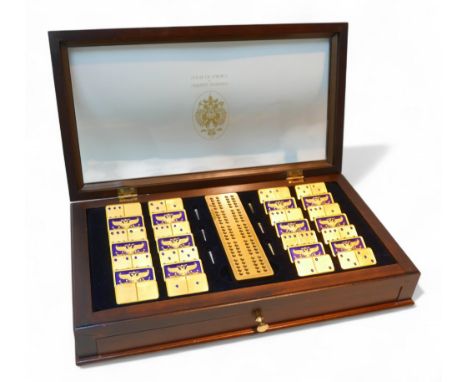 A Franklin Mint cased set of 'The Faberge Imperial Dominoes by the House of Faberge', with twenty-eight 22ct gold plated domi