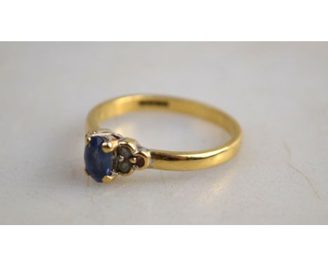 A 9ct ring set blue synthetic spinnel and six diamonds, 9ct yellow gold, size M [BP10]