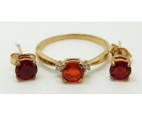 A 9ct gold ring set with a round cut Salamanca fire opal and diamonds (size N) and a pair of 9ct gold earrings set with round