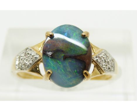 A 9ct gold ring set with an oval boulder opal cabochon of approximately 1.6cts and diamonds, 2.2g, size N