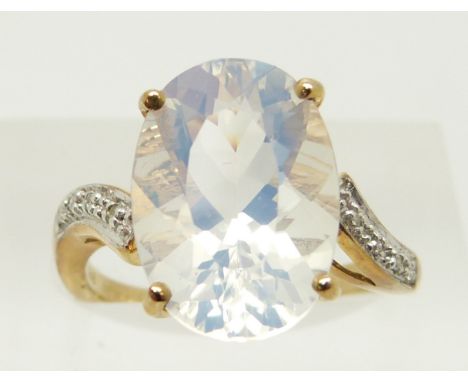 A 9ct gold ring set with an oval cut ice opal and diamonds, 3.6g, size N