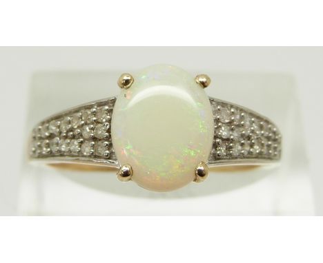 A 9ct gold ring set with an oval Ethiopian opal cabochon and diamonds, size R, 2.5g