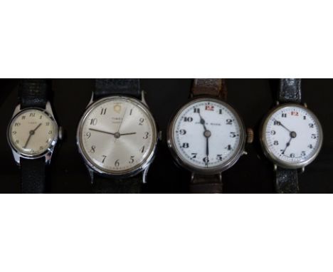 Four wristwatches comprising one Swiss silver trench style, a similar nickel example and two matching ladies and gentleman's 