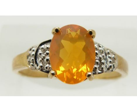 A 9ct gold ring set with an oval cut fire opal and diamonds, 1.7g, size N