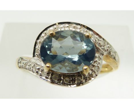 A 9ct gold ring set with an oval blue fire opal and diamonds, 2.2g, size N