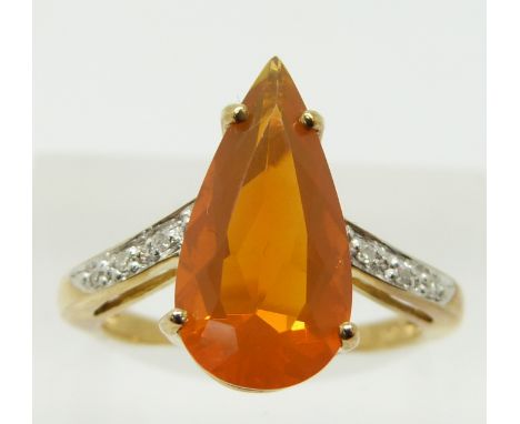 A 9ct gold ring set with a pear cut fire opal and diamonds, 3g, size N