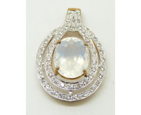 A 9ct gold ring set with an oval cut ice opal surrounded by topaz, 3.3g