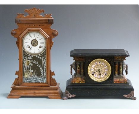 A 19thC American gingerbread clock with Roman dial and alarm feature, 56cm tall together with a faux slate and marble mantel 