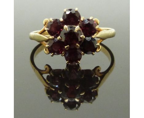 A 9ct gold cluster ring set with a cluster of garnets, size R, 3.00g&nbsp;