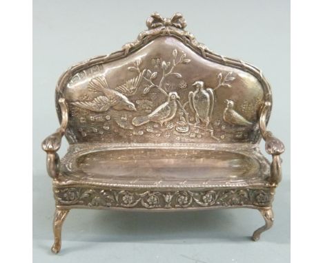 Novelty Edward VII hallmarked silver doll's house sofa having embossed decoration of birds to the back, Sheffield 1901,&nbsp;