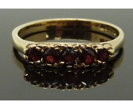 A 9ct gold ring set with garnets, size Q/R, 2.32g&nbsp;