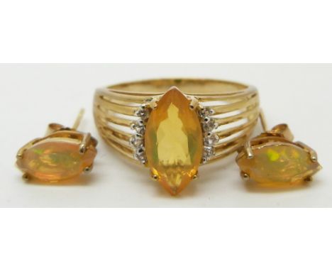 A 9ct gold ring set with a marquise cut opal (size R/S) with matching earrings