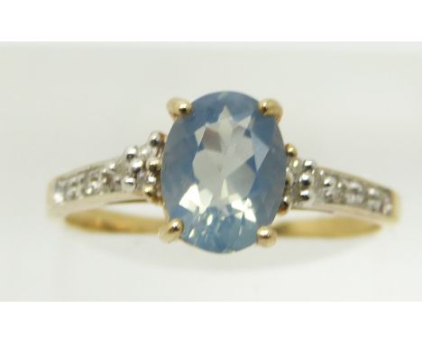 A 9ct gold ring set with an oval blue fire opal and diamonds, 1.8g, size N