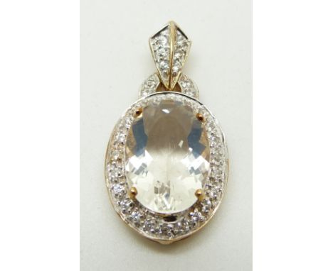 A 9ct gold pendant set with an oval cut ice opal surrounded by zircon, 3.2g