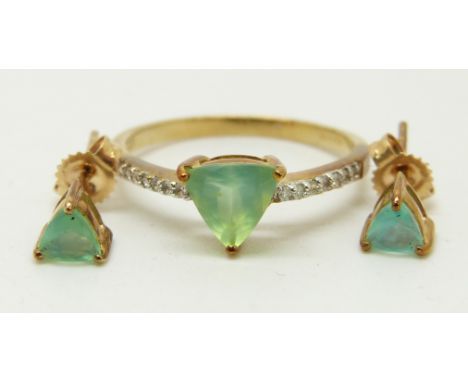 A 9ct gold ring set with a trilliant cut Paraiba opal and diamonds, with a pair of similar earrings, 2.2g, size N