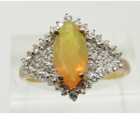 A 9ct gold ring set with a marquise cut Indonesian opal and zircons, 3g, size S